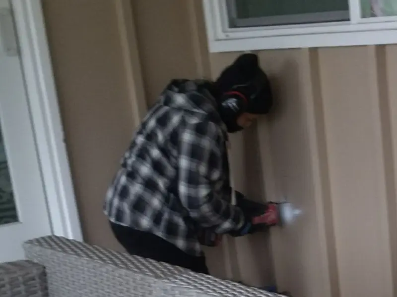 Professional electrician installing an exterior outlet in Stroud